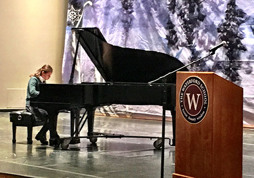Sarah Shipp performing piano at this morning's assembly.