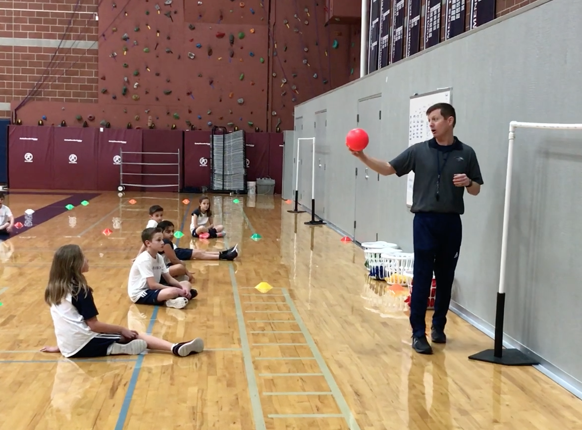 Tim Pettus teaches students about compromise in Waterford's physical education class 