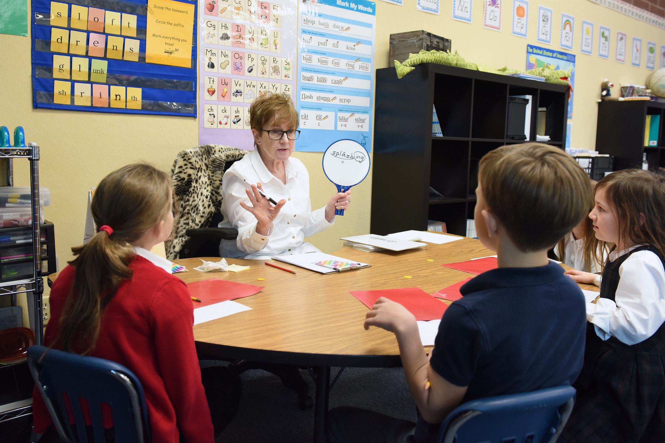 Melinda Zabriskie, Reading Assistant and Retired Waterford Class I Teacher, working with students on a Fundations unit.