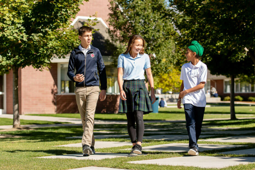 3 waterford students walking outside school
